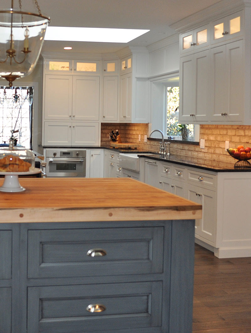 White shaker cabinets with blue gray island